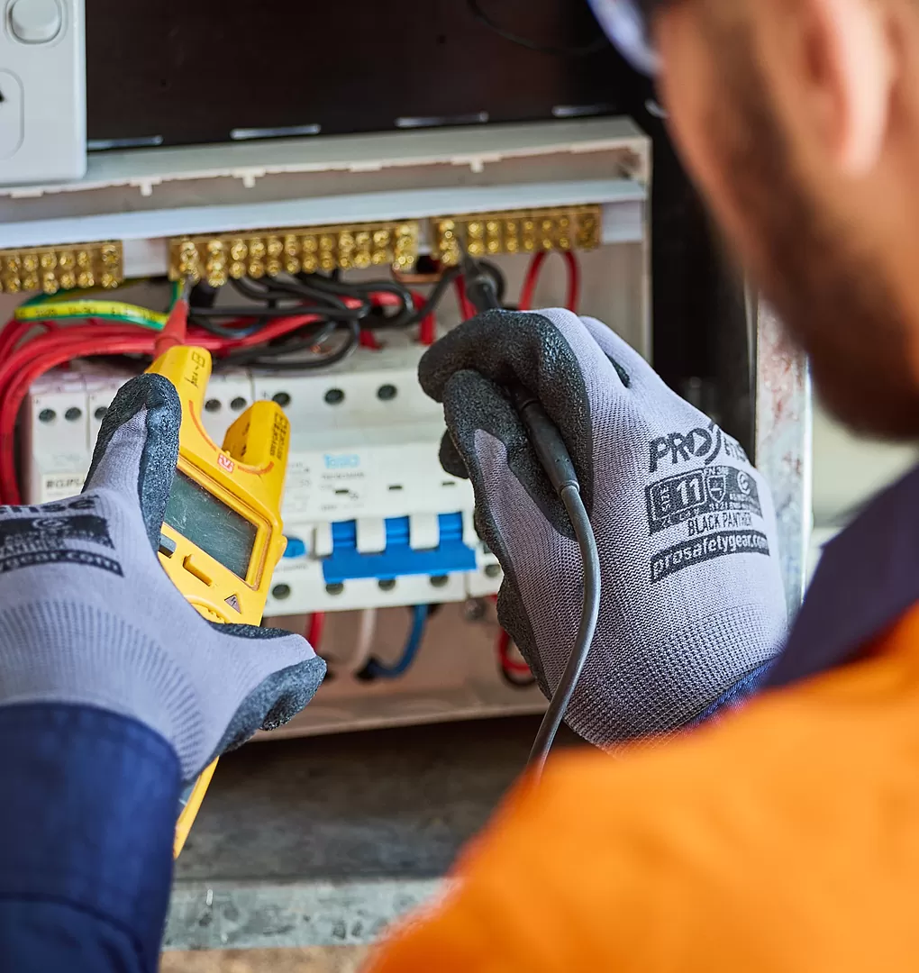 Electrician Testing the Switchboard